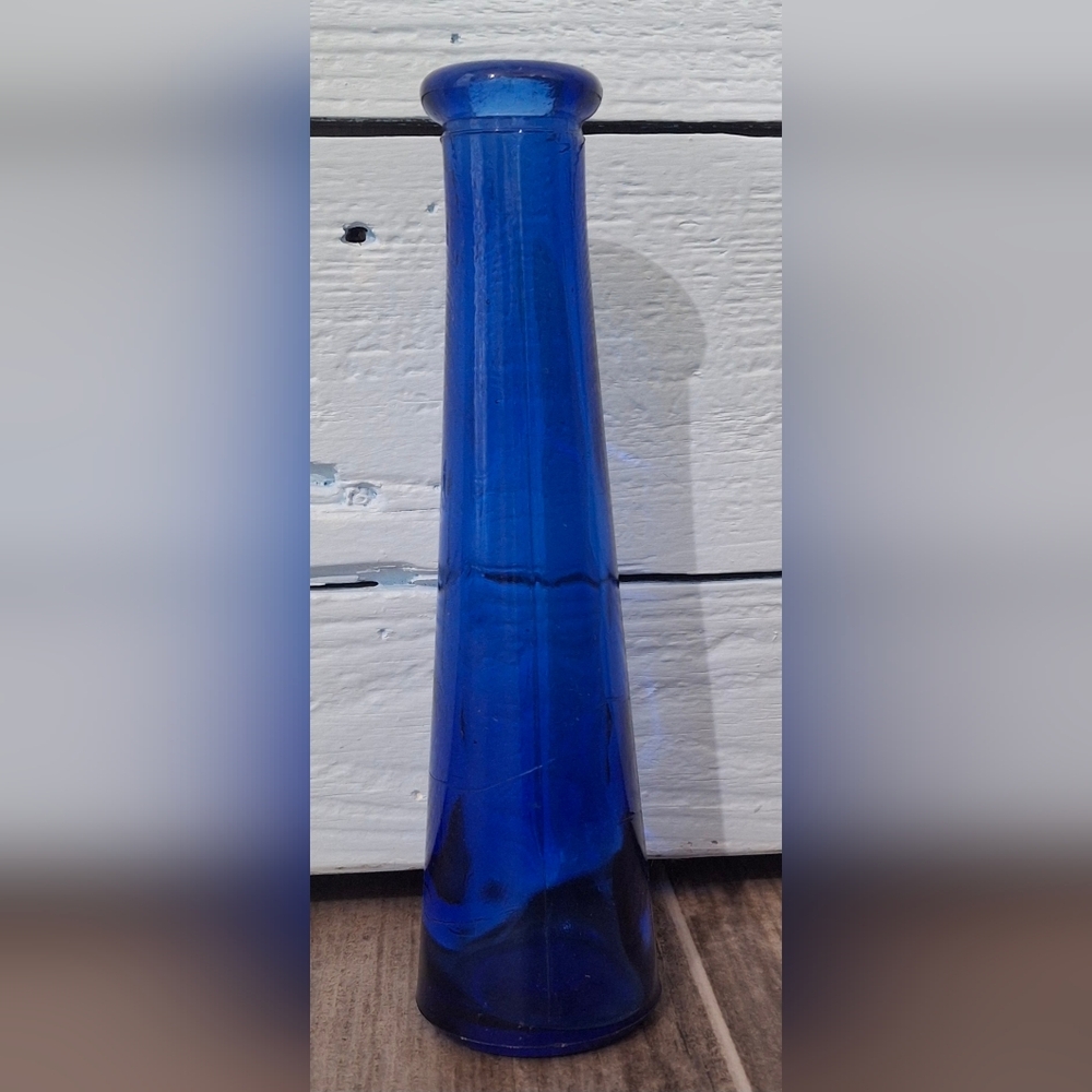 COLBALT BLUE CONE SHAPED BOTTLE.